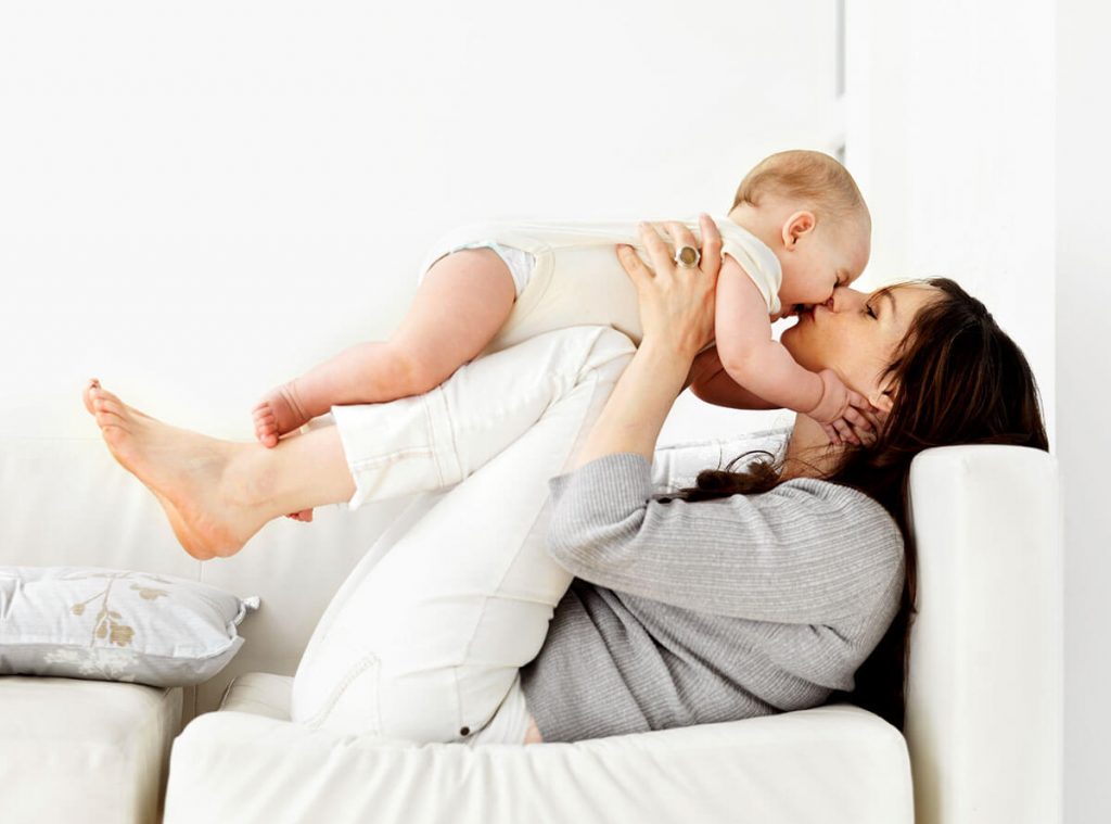 Mother on couch with child 