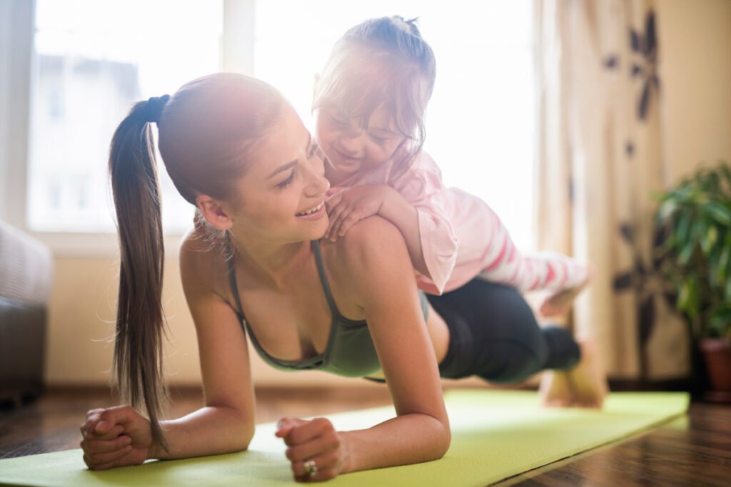 Mother working out with her young daughter