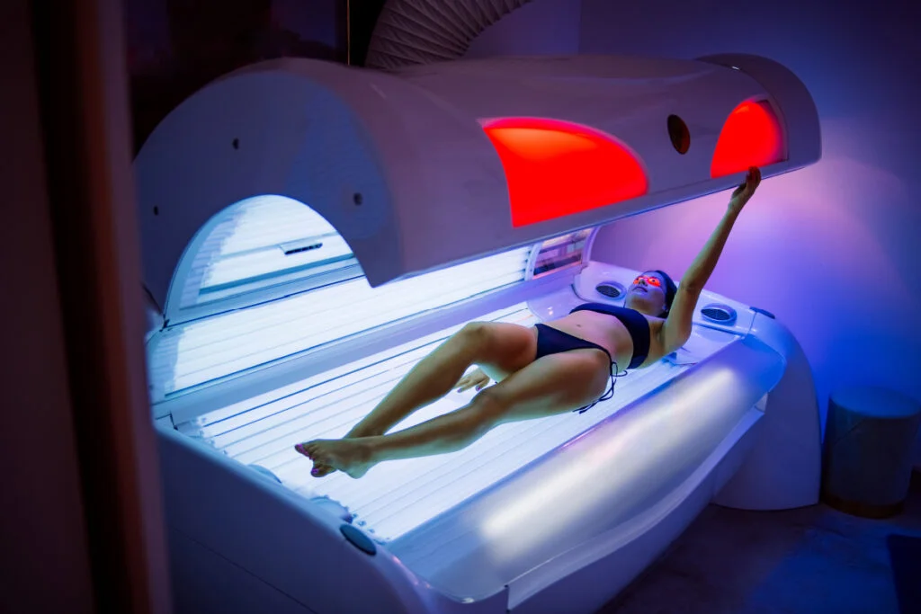 Woman using a tanning bed